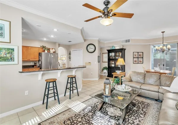 a living room with furniture and a clock