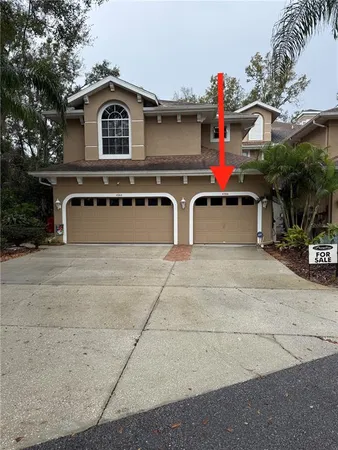 a front view of a house with a garage