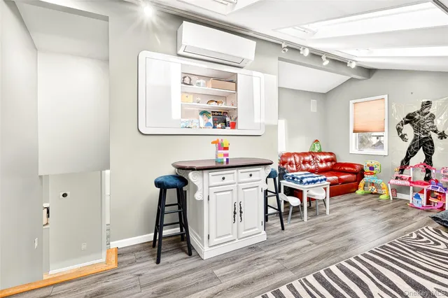 a workspace with furniture and wooden floor