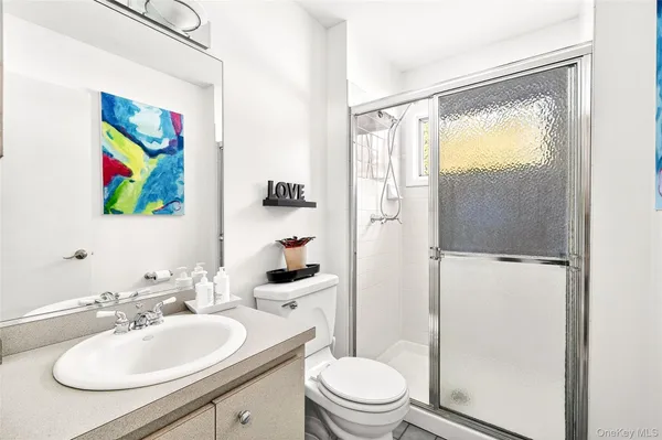 a bathroom with a sink a toilet and a bathtub