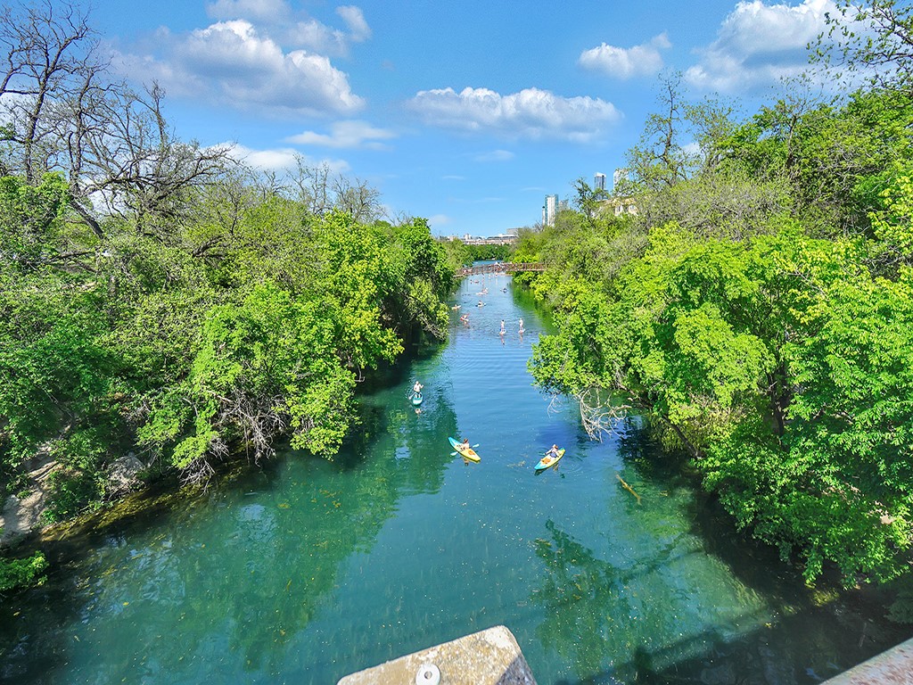 a view of a lake with a yard