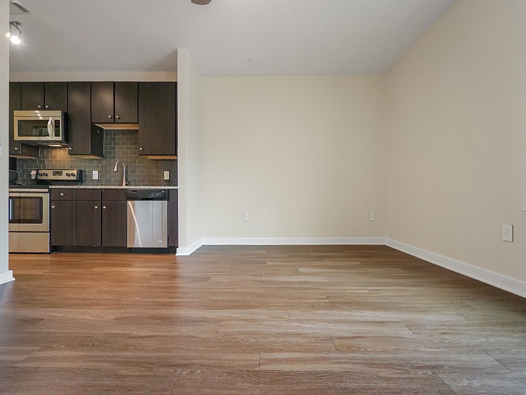 1900 Barton Springs Road, Unit 4013A Austin, TX 78704 - Photo 23 of 31 a view of kitchen with stainless steel appliances wooden floor and granite counter top