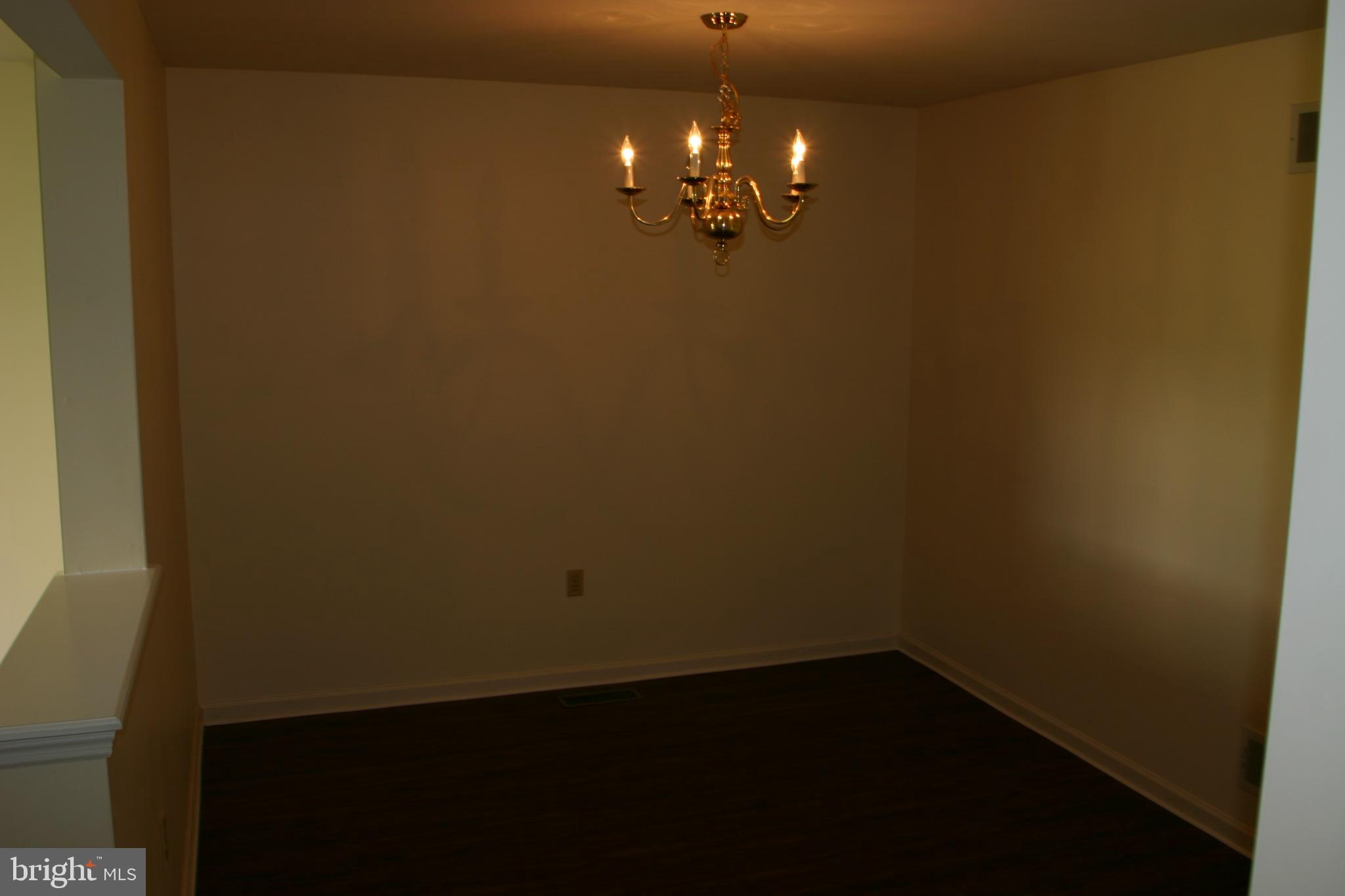 19-3 Cranberry Ridge, Unit 193 Reading, PA 19606 - Photo 12 of 22 Elegant space with a classic chandelier.