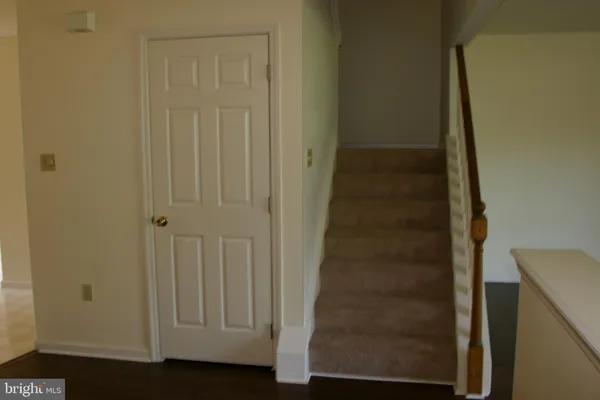 a view of an empty room with stairs