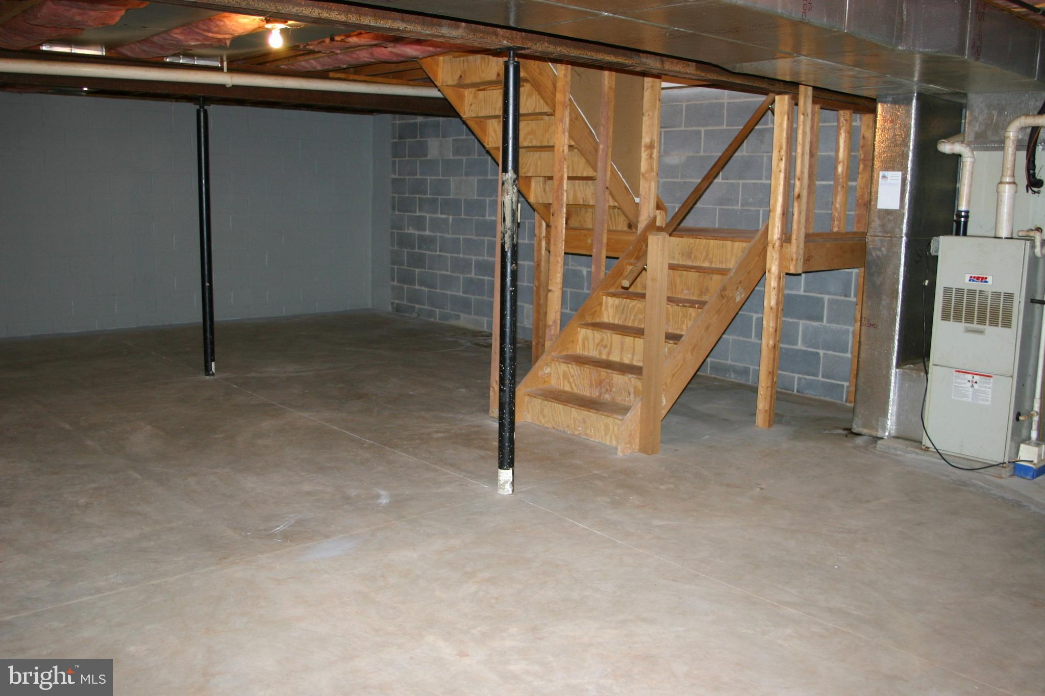 19-3 Cranberry Ridge, Unit 193 Reading, PA 19606 - Photo 22 of 22 Spacious basement with wooden staircase.