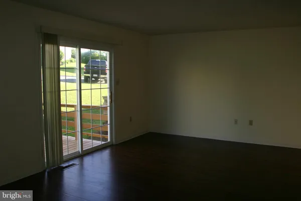 a view of a livingroom with wooden floor