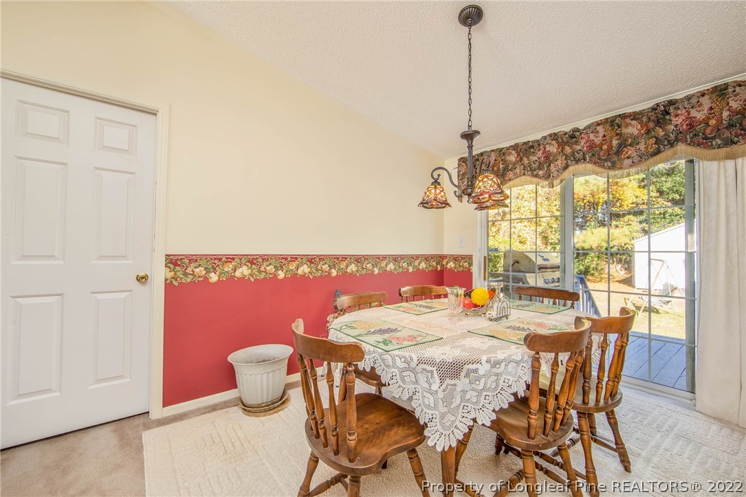 5384 Wade-Stedman Road Wade, NC 28395 - Photo 11 of 18 a dining room with furniture and window