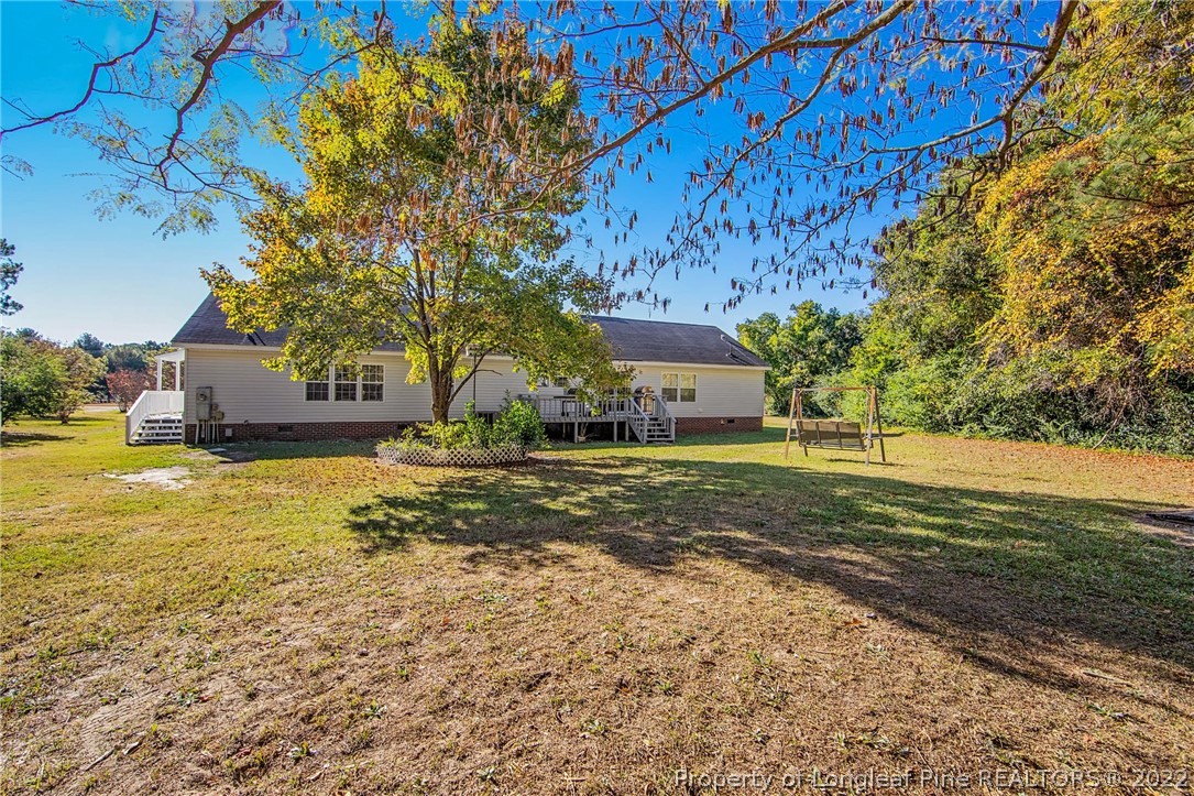 5384 Wade-Stedman Road Wade, NC 28395 - Photo 18 of 18 a view of a house with a yard