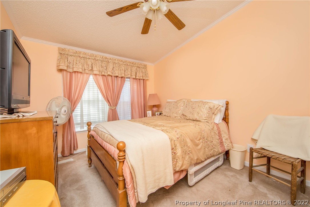 5384 Wade-Stedman Road Wade, NC 28395 - Photo 7 of 18 a bed room with a bed and a chair