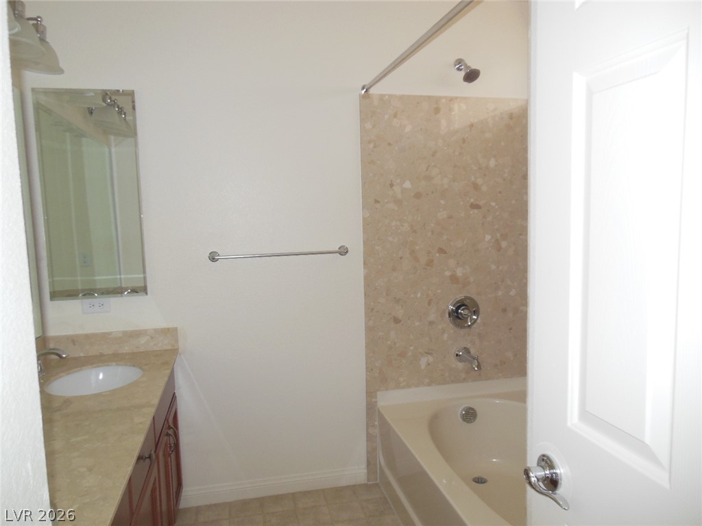 6390 Jackson Spring Road Las Vegas, NV 89118 - Photo 18 of 27 A refined bathroom featuring a spacious bathtub and elegant marble vanity.