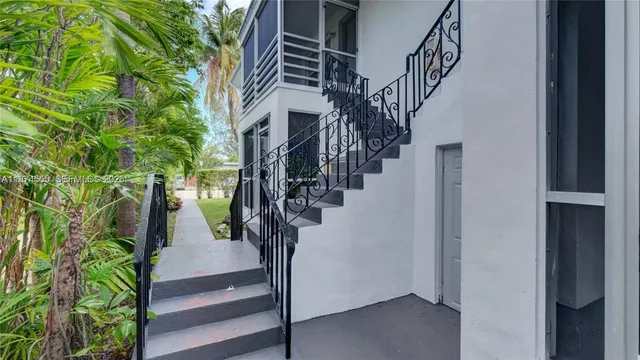 a view of entryway with wooden floor