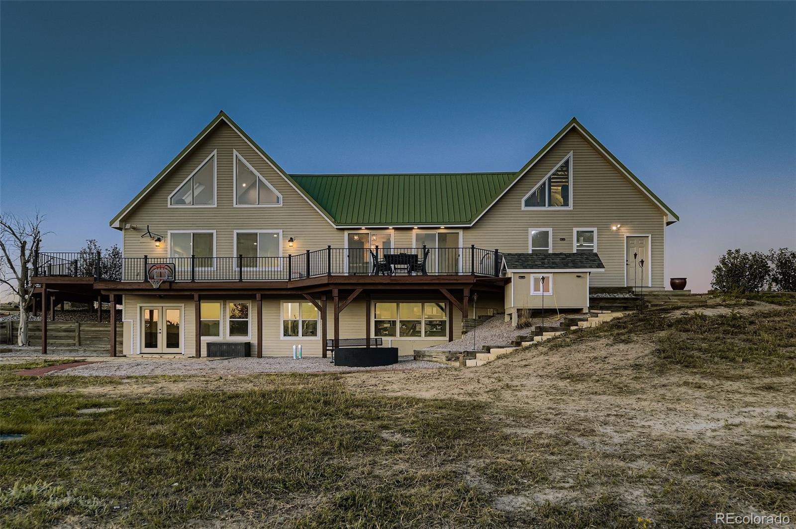 a front view of a house with a yard and balcony