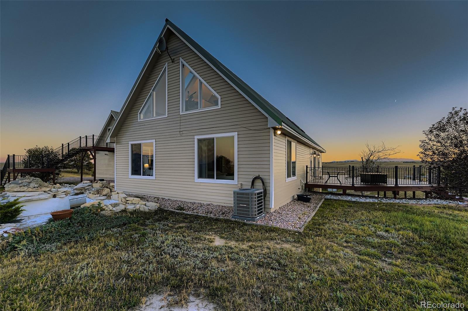 28242 Stone Horse Ranch Road Elbert, CO 80106 - Photo 27 of 39 a view of a house with a yard
