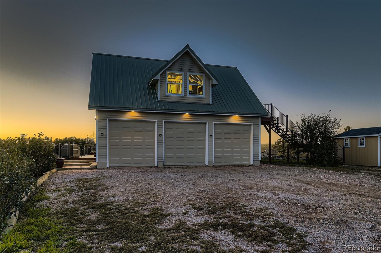 28242 Stone Horse Ranch Road Elbert, CO 80106 - Photo 30 of 39 a front view of a house with a yard