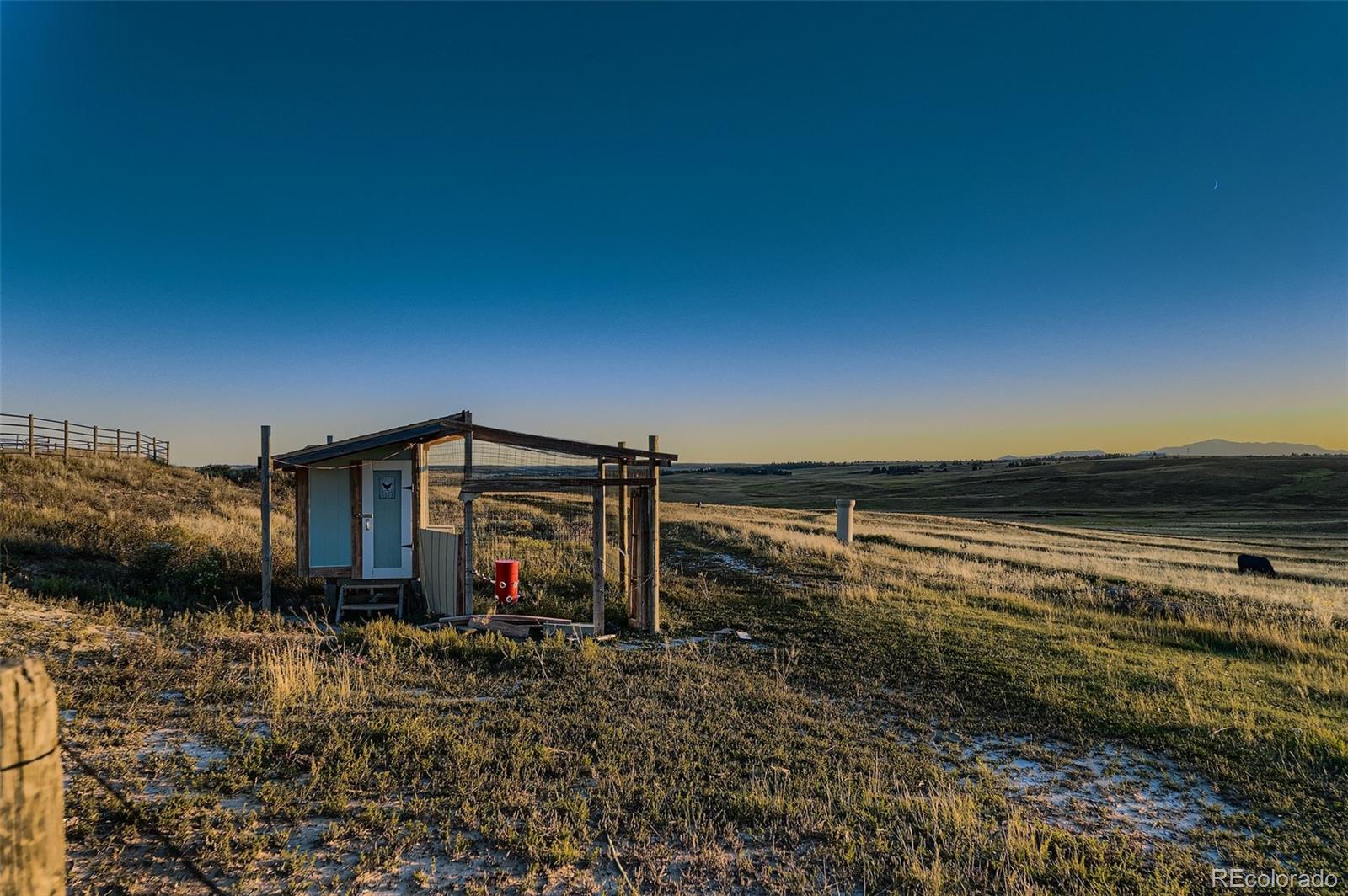 28242 Stone Horse Ranch Road Elbert, CO 80106 - Photo 33 of 39 a view of a house with a yard