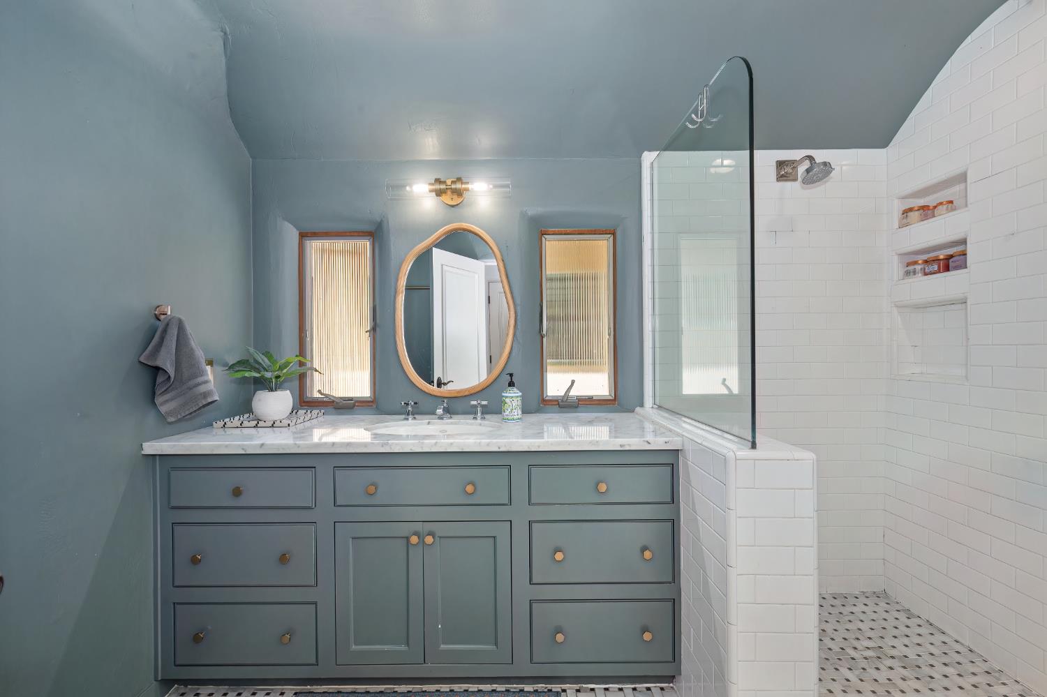 3501 Cutter Way Sacramento, CA 95818 - Photo 61 of 89 a bathroom with a granite countertop sink vanity granite and a mirror