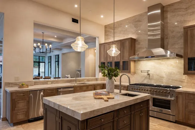 a kitchen with a stove a sink and a refrigerator