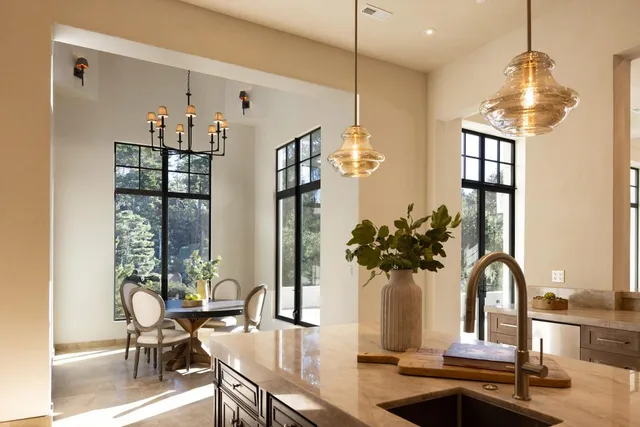 a view of a dining room with furniture and a window
