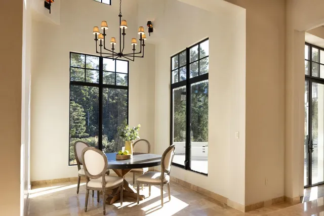 a dining room with furniture and window