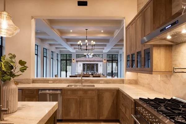 a kitchen with stainless steel appliances granite countertop a sink and stove