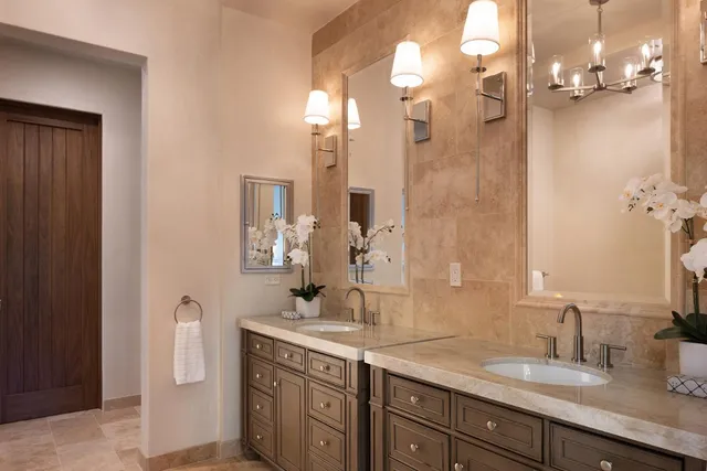 a bathroom with a shower sink and mirror