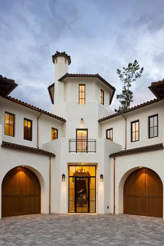 a front view of a house with a garage