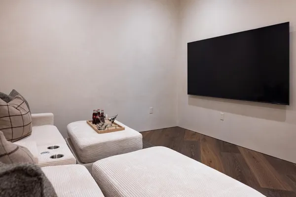 a living room with furniture and a chandelier