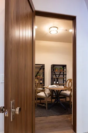 a view of a dining room with furniture and wooden floor