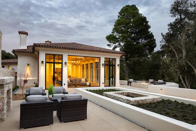 a balcony with furniture and large window