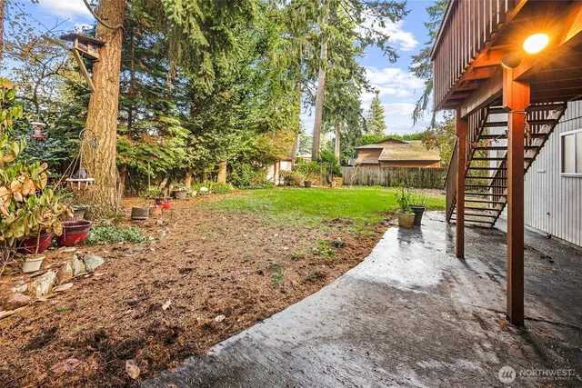 a view of a backyard with pathway