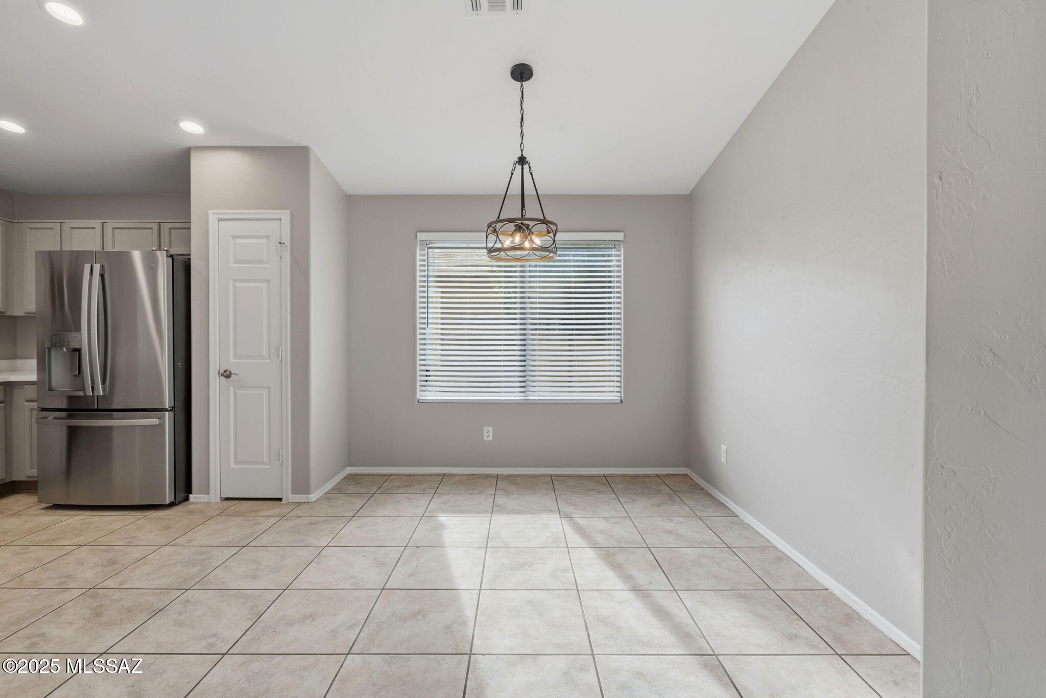8244 South Lost Mountain Road Tucson, AZ 85747 - Photo 12 of 41 a view of an empty room with a window