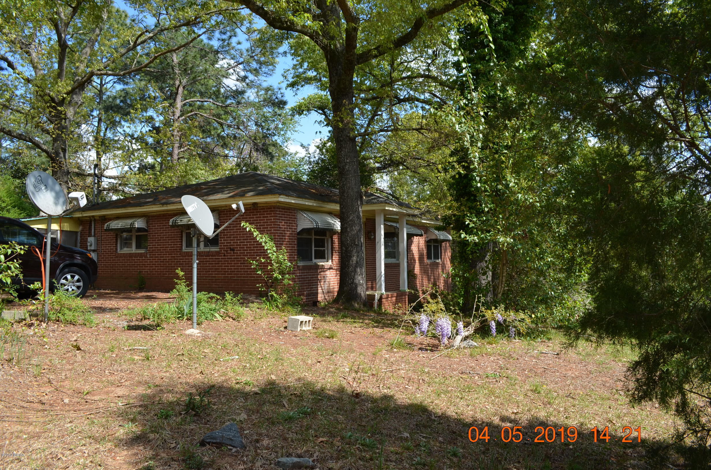 1974 Manson Road Macon, GA 31217 - Photo 2 of 15 a view of a barn in the middle of a yard