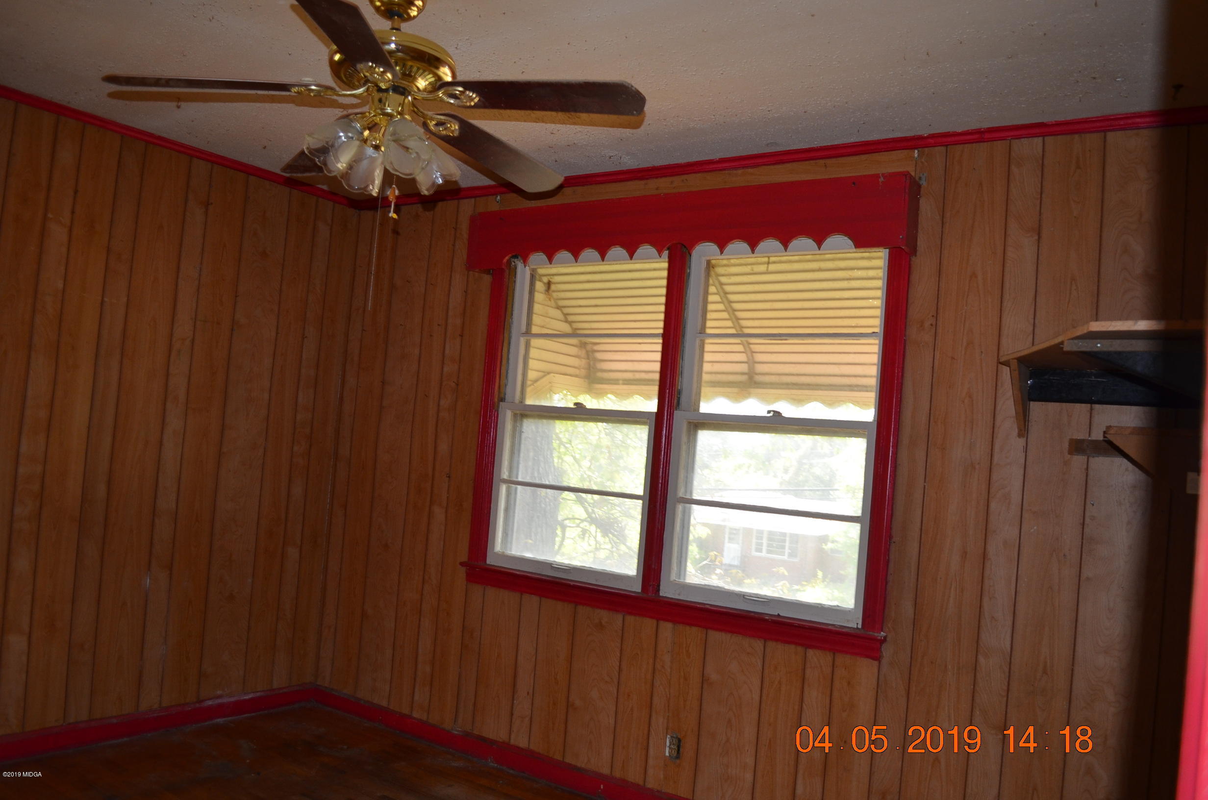1974 Manson Road Macon, GA 31217 - Photo 6 of 15 a view of a livingroom with a window and a ceiling fan