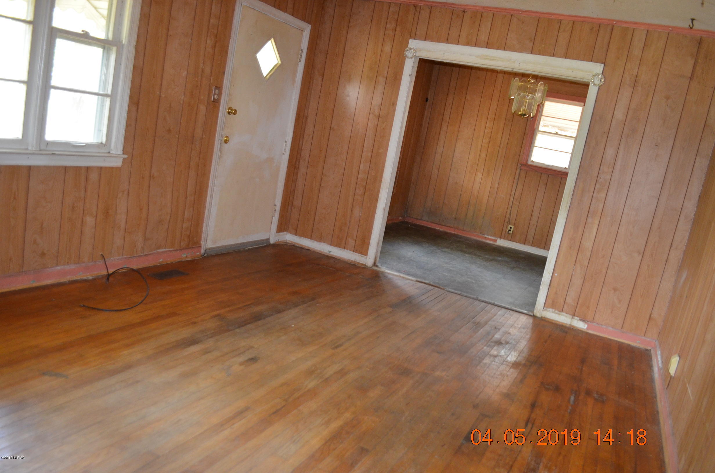 1974 Manson Road Macon, GA 31217 - Photo 10 of 15 an empty room with wooden floor and windows