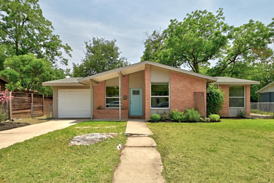 6209 Peggy Street Austin, TX 78723 - Photo 1 of 26 a front view of house with yard and green space