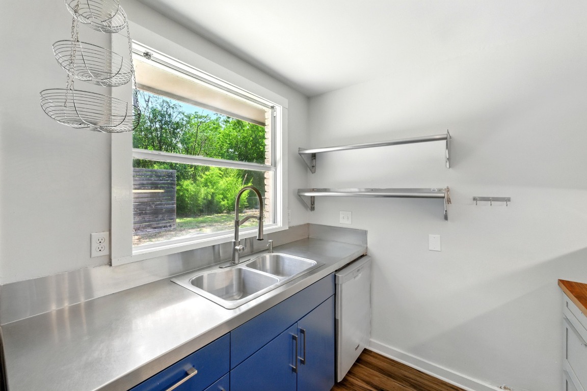 6209 Peggy Street Austin, TX 78723 - Photo 11 of 26 a kitchen with a sink and large window