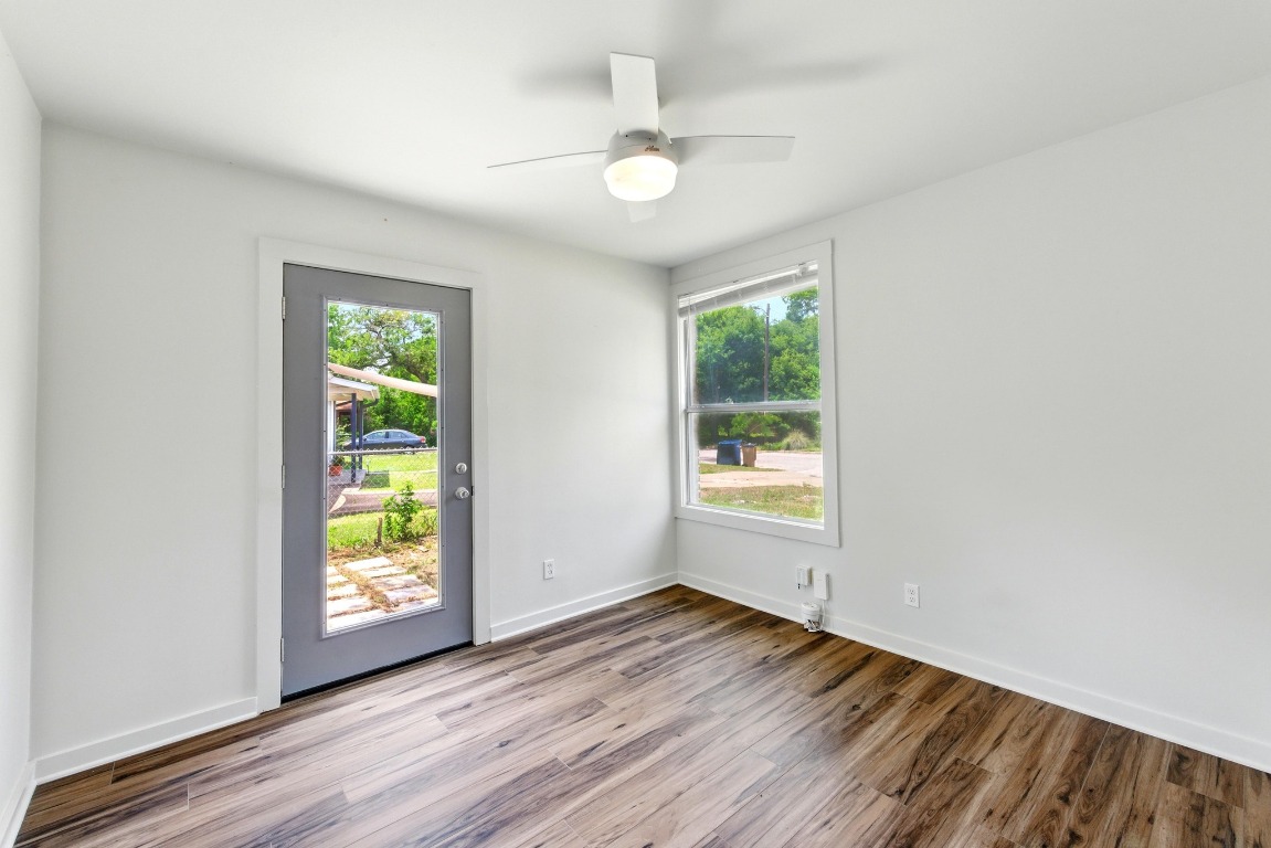 6209 Peggy Street Austin, TX 78723 - Photo 16 of 26 an empty room with windows and ceiling fan