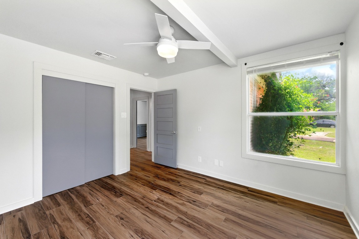 6209 Peggy Street Austin, TX 78723 - Photo 17 of 26 a view of an empty room with wooden floor and a window