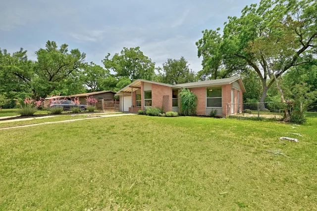 a house view with a garden space