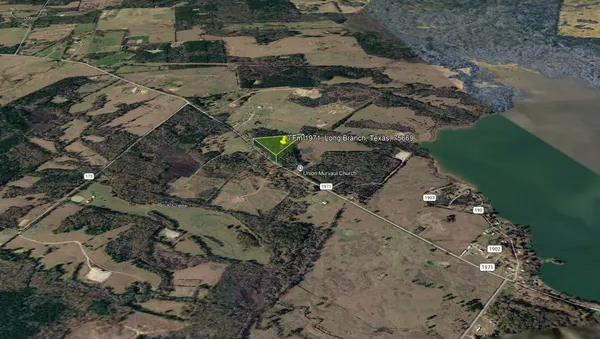 a aerial view of a house with a yard