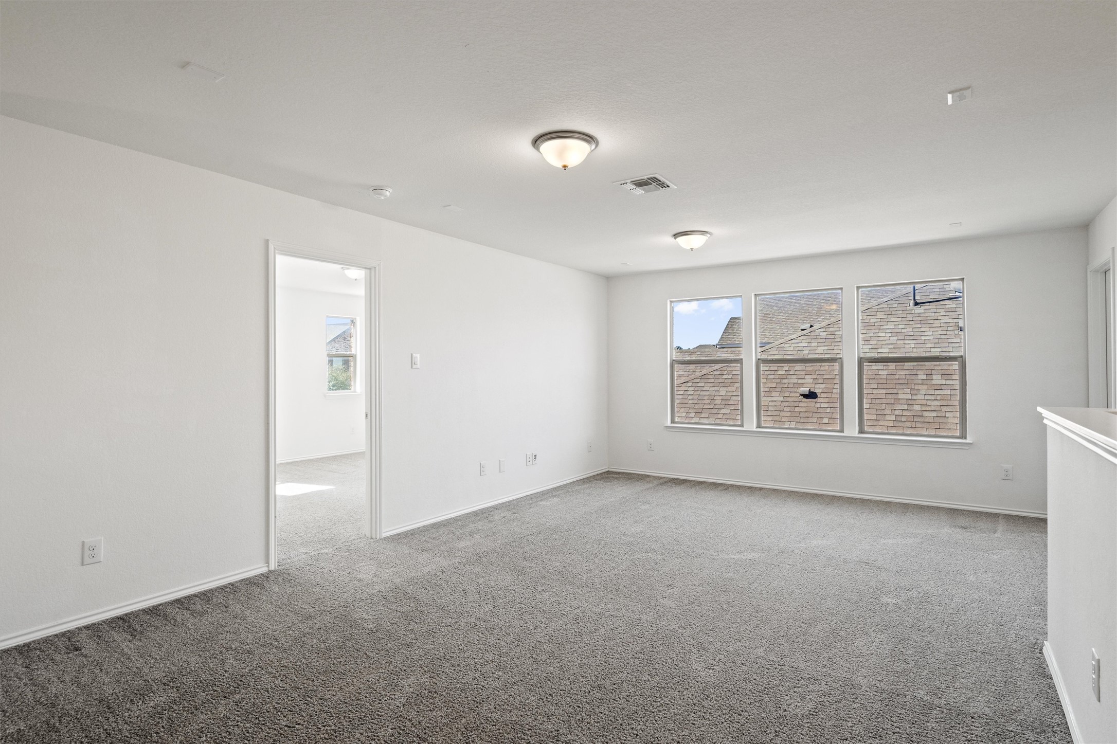 1901 Bogata Lane Leander, TX 78641 - Photo 22 of 40 Empty room with carpet flooring and baseboards