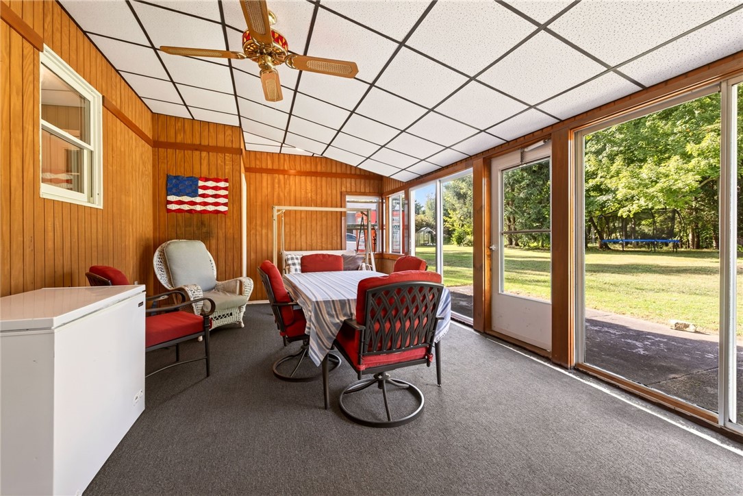 7663 Ridge Road Sodus, NY 14551 - Photo 17 of 49 3 season room overlooking backyard