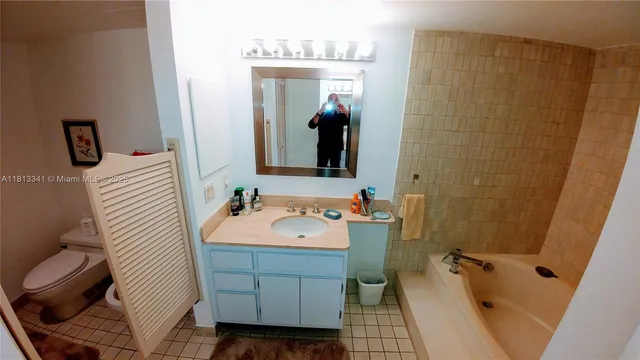 a bedroom with bed and a window