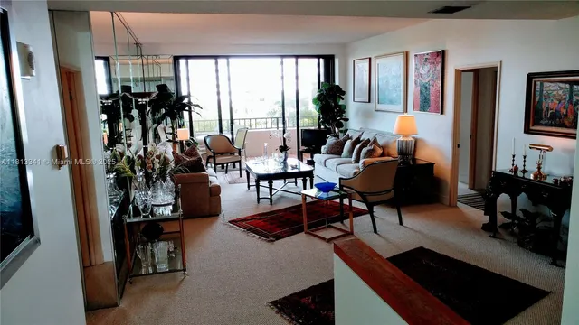 a living room with furniture and a lamp