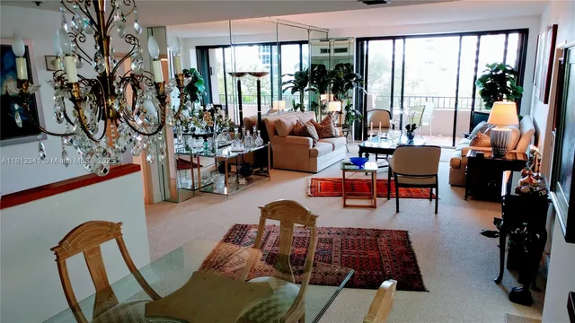 a kitchen with stainless steel appliances a refrigerator a stove a sink and white cabinets