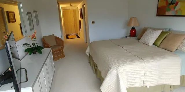 a bedroom with bed and window