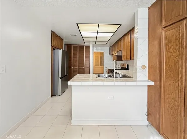 a view of kitchen with granite countertop window and a sink