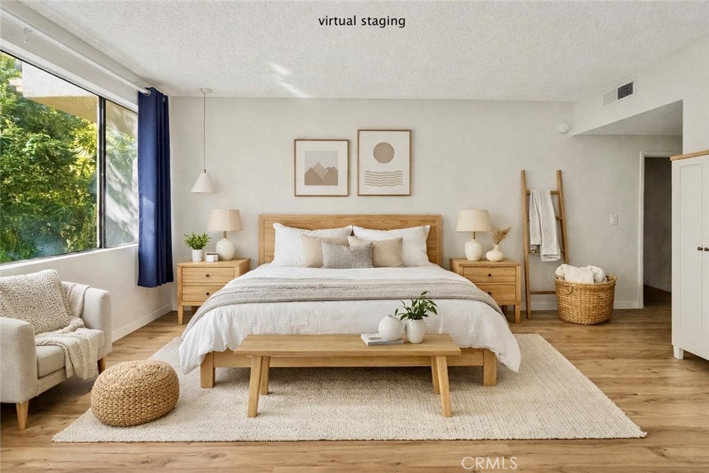 415 West Duarte Road, Unit 2 Arcadia, CA 91007 - Photo 18 of 30 a bedroom with a bed and wooden floor