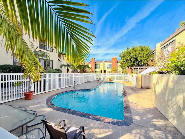 a view of a swimming pool with a patio