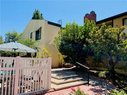 a front view of a house with yard